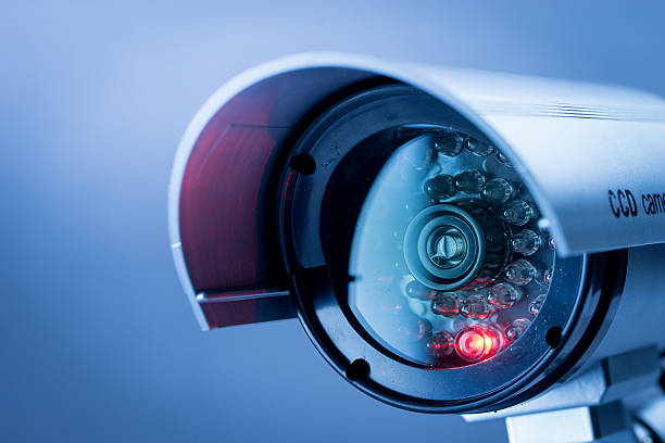 Security, CCTV camera for office building at night in London. Security, CCTV camera for office building at night in London.